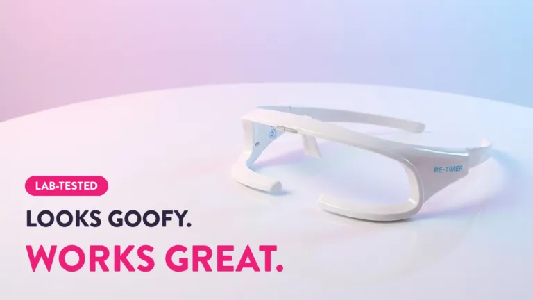 Re-Timer light therapy glasses on white surface with "Looks Goofy. Works Great." lab-tested sleep device tagline