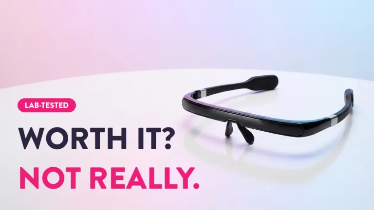 Lab-tested AR smart glasses review: Worth it? Not really. Sleek black augmented reality eyewear on white surface.