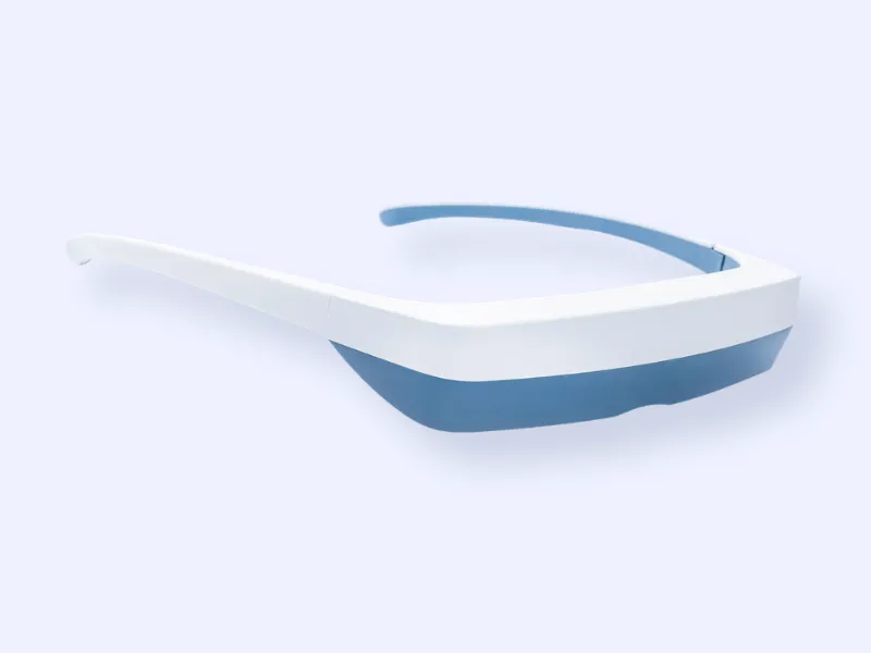 A pair of futuristic-looking glasses with a white frame and blue-tinted visor, resting on a light gray background.
