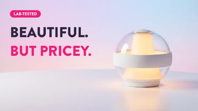 Lab-tested globe-shaped smart lamp glowing warm white light with clear spherical diffuser — beautiful but pricey review