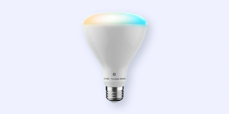 A smart LED light bulb with a standard screw base, featuring a white body and a subtle gradient of warm yellow and cool blue light at the top, labeled CYNC Tunable White.