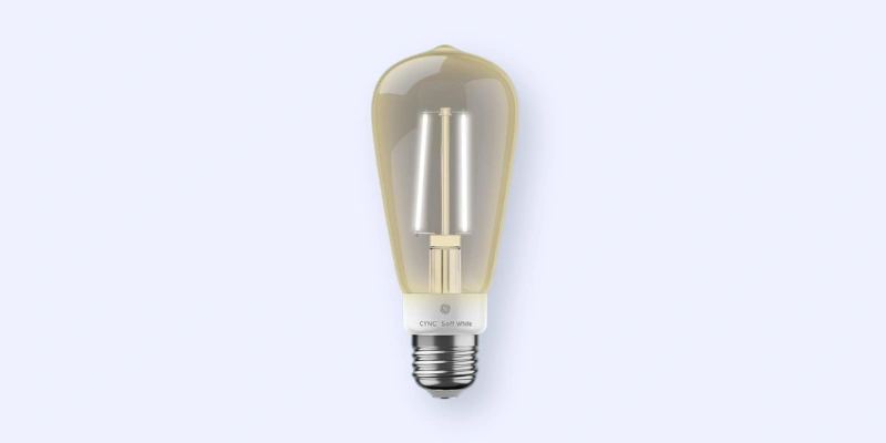 A single vintage-style LED light bulb with a visible filament, clear glass, and a silver screw base, set against a plain light gray background.