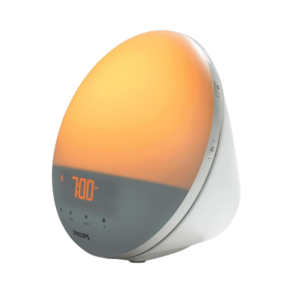 Philips SmartSleep wake-up light alarm clock with sunrise simulation glowing warm orange at 7:00