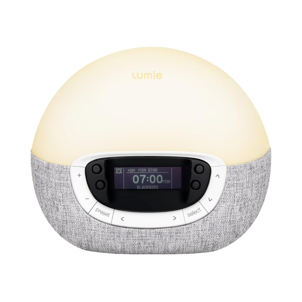 Lumie Bodyclock Shine 300 wake-up light alarm clock with glowing dome and DAB radio displaying 07:00