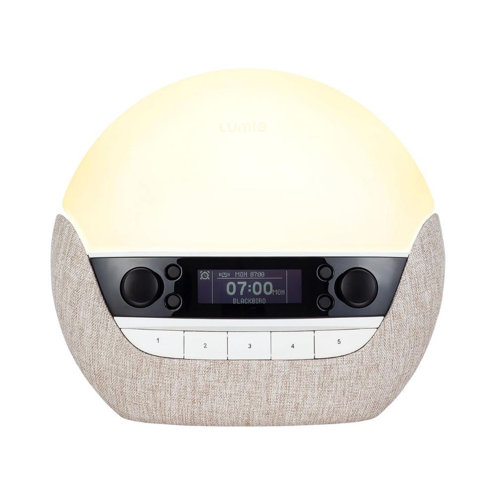 Lumie Bodyclock Shine 300 wake-up light alarm clock with glowing dome and DAB radio displaying 07:00