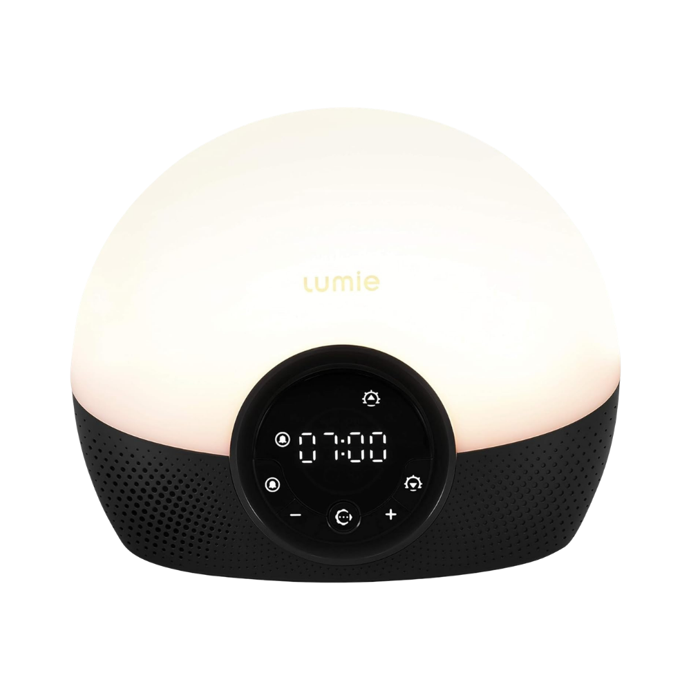 Lumie Bodyclock Shine 300 sunrise alarm clock with warm glowing dome light and DAB radio display showing 07:00