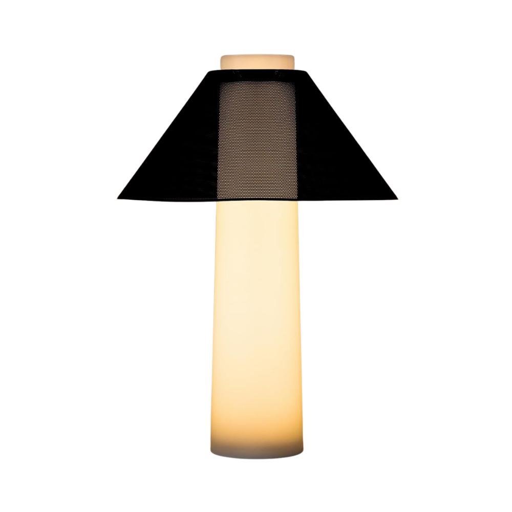 Modern table lamp with glowing white cylindrical base and black perforated mesh shade, minimalist designer lighting