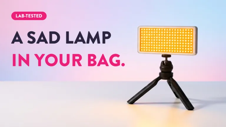 Lab-tested portable SAD lamp on mini tripod for light therapy, compact enough to fit in your bag
