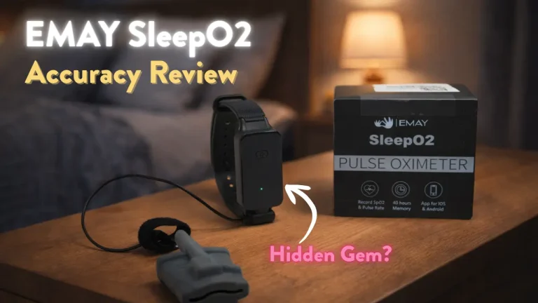 A bedside table displays an EMAY SleepO2 pulse oximeter device, its box, and a sensor. Text on the image reads: EMAY SleepO2 Accuracy Review and Hidden Gem? with a cozy, blurred bedroom in the background.