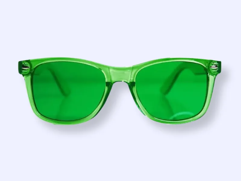 Green-framed sunglasses with green tinted lenses, displayed against a light gray background.