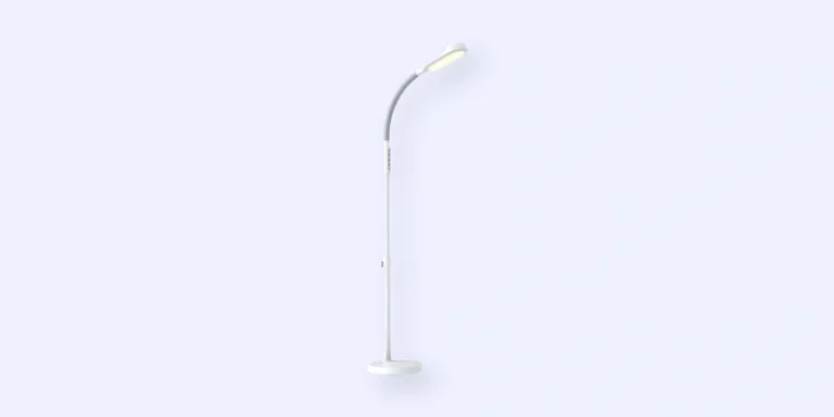 A modern, white, minimalist floor lamp with a curved neck and an LED light head, standing against a plain, light-gray background.