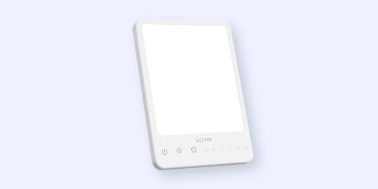 A rectangular white light therapy lamp with touch controls along the bottom, including power and brightness icons. The lamp is standing upright against a light background.
