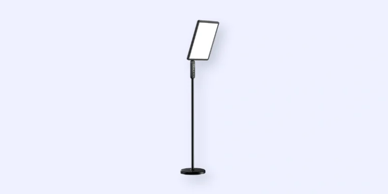 A modern black floor lamp with a rectangular, slightly angled light panel and a slim pole stand on a round base, set against a plain light background.