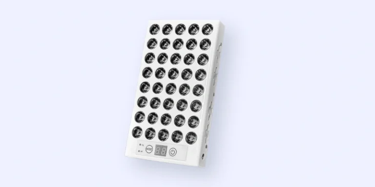 A rectangular LED light therapy panel with six rows of round LED bulbs, a control panel with buttons and display at the bottom, set against a light gray background.