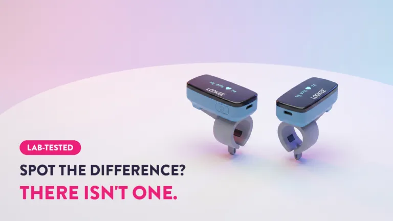 Two LOOKEE ring oximeters side by side displaying SpO2 97% and heart rate 74, lab-tested pulse oximeter comparison