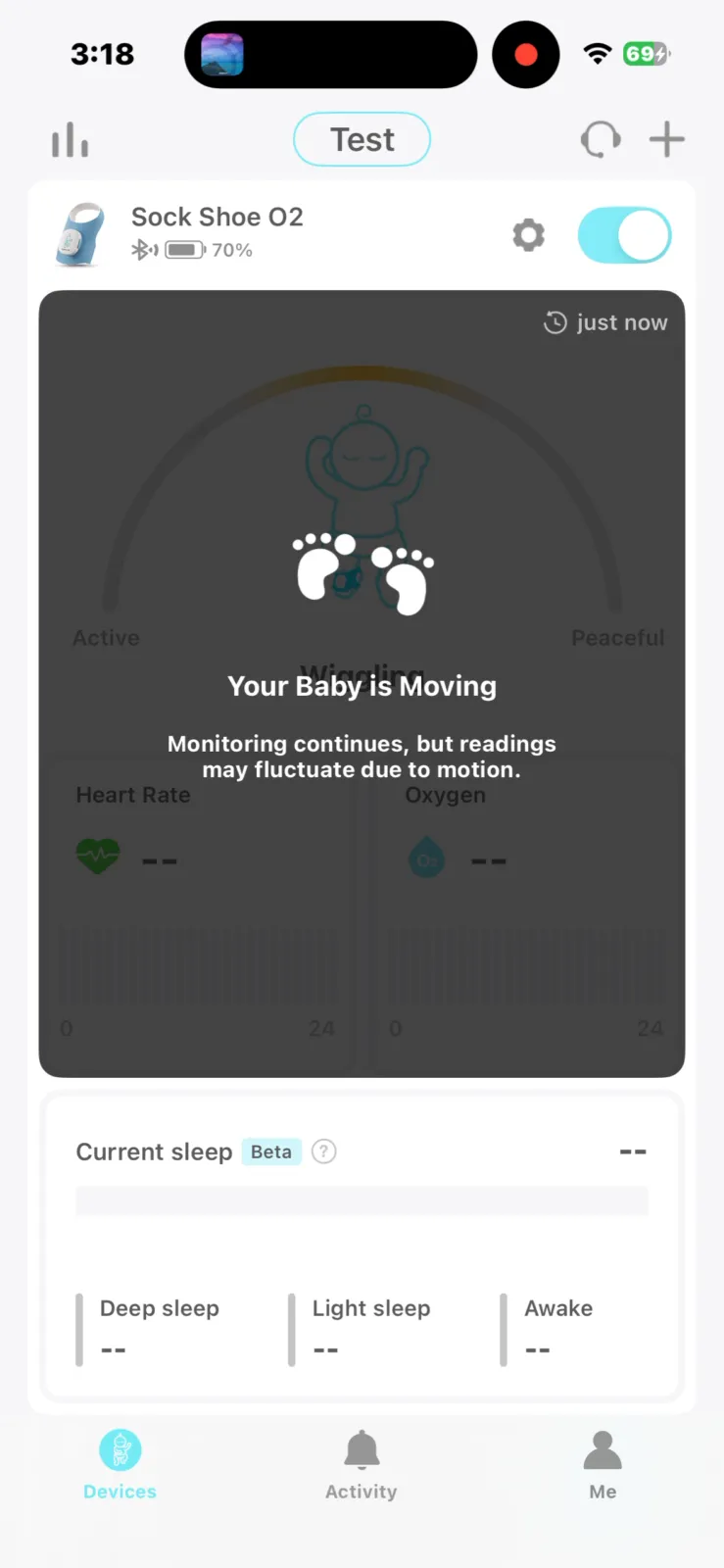 Baby monitor app showing Your Baby is Moving alert with heart rate and oxygen tracking on Owlet sock device at 70% battery
