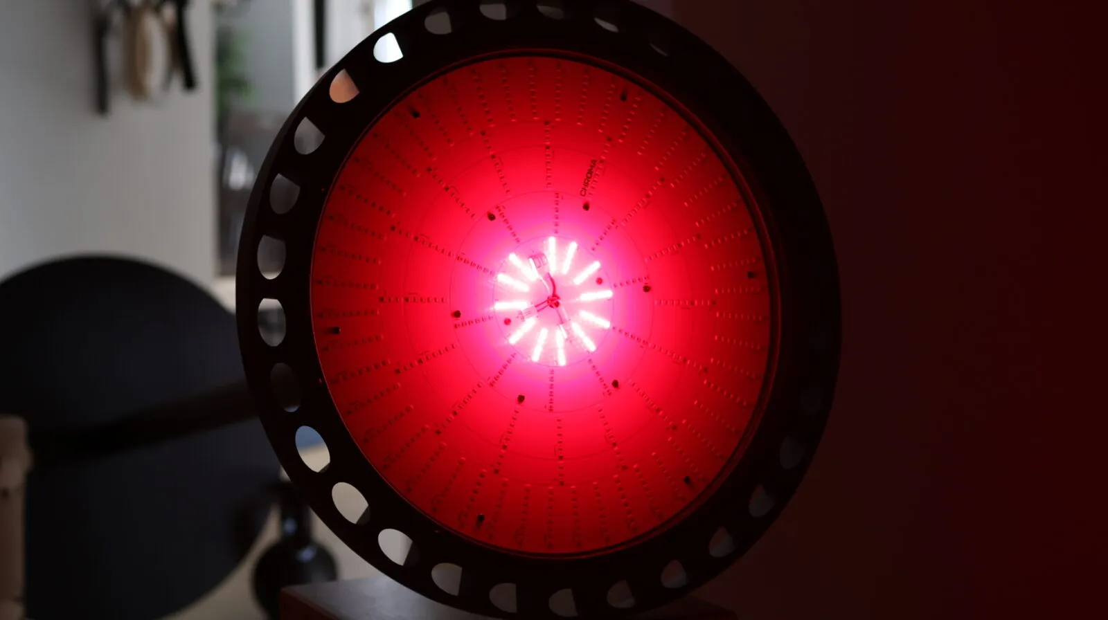 Circular LED grow light panel with white and amber diodes arranged in concentric rings, viewed from below