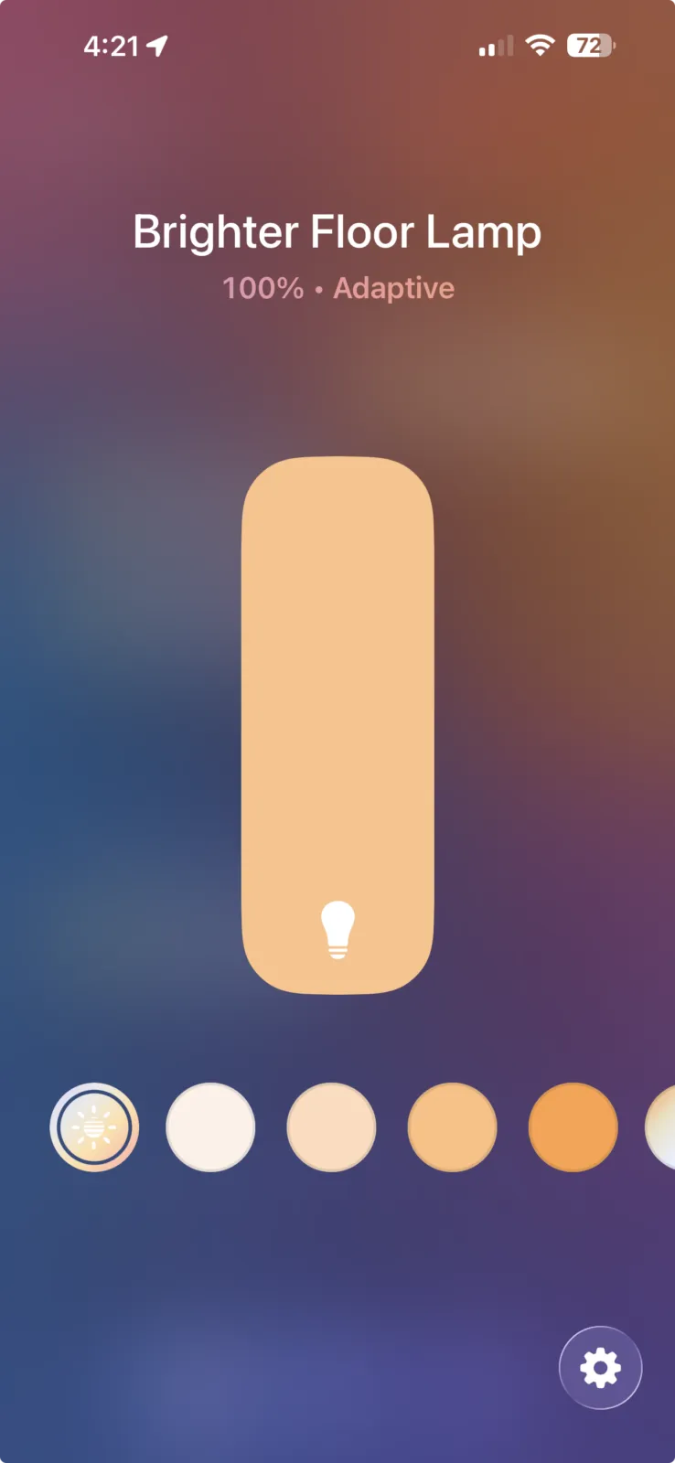 Smart home app controlling a floor lamp at 100% brightness with adaptive warm light setting on iOS