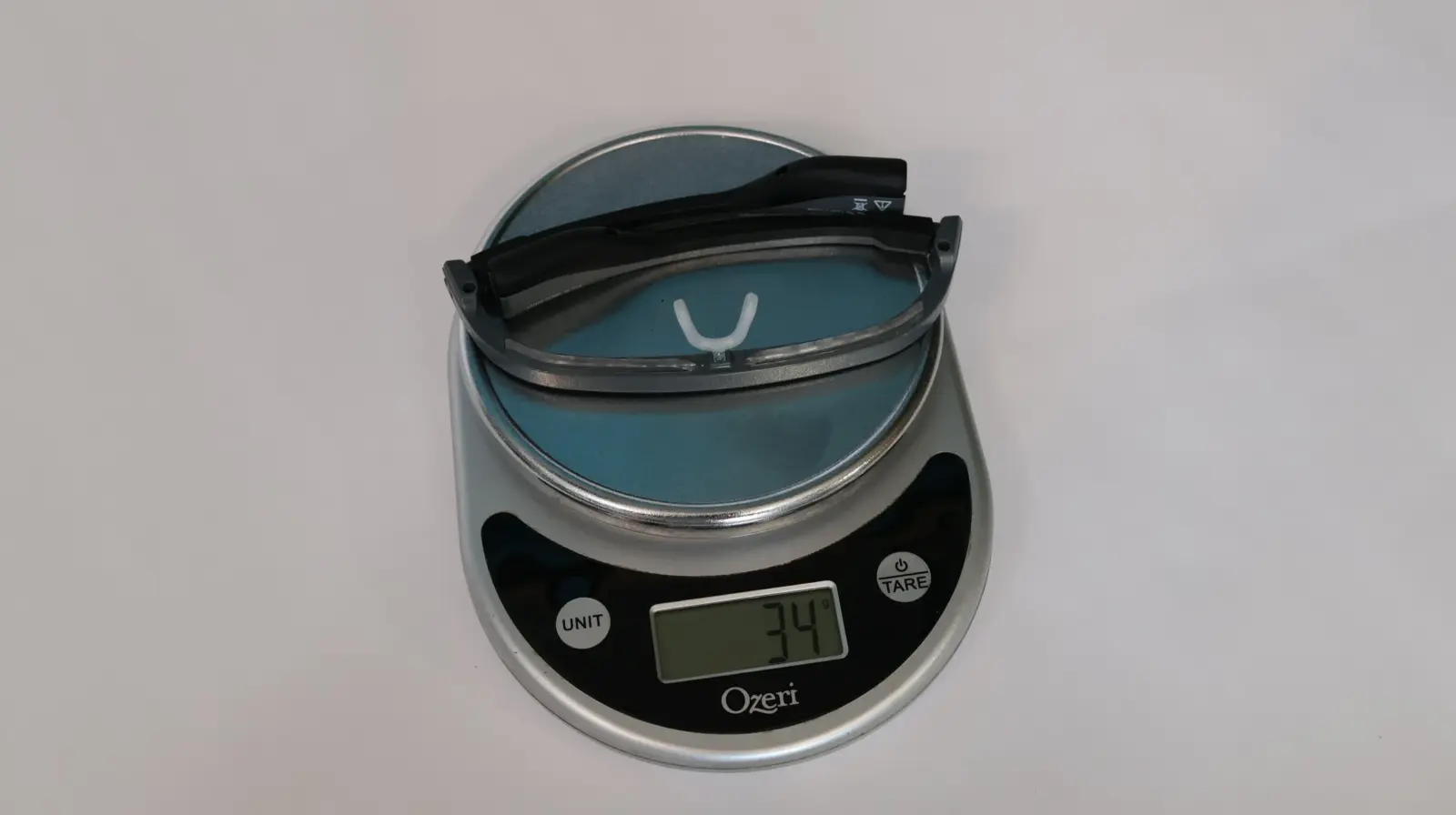 ayo on an Ozeri digital kitchen scale displaying 34 grams