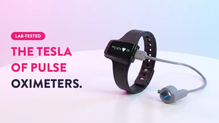 Lab-tested wrist pulse oximeter displaying SpO2 97% and heart rate 78, connected to a finger probe sensor